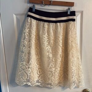 Knee-Length Cream A-Line Skirt with Lace Embellishments